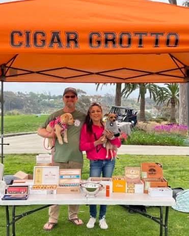 Gregg and his wife at a Cigar Grotto event booth