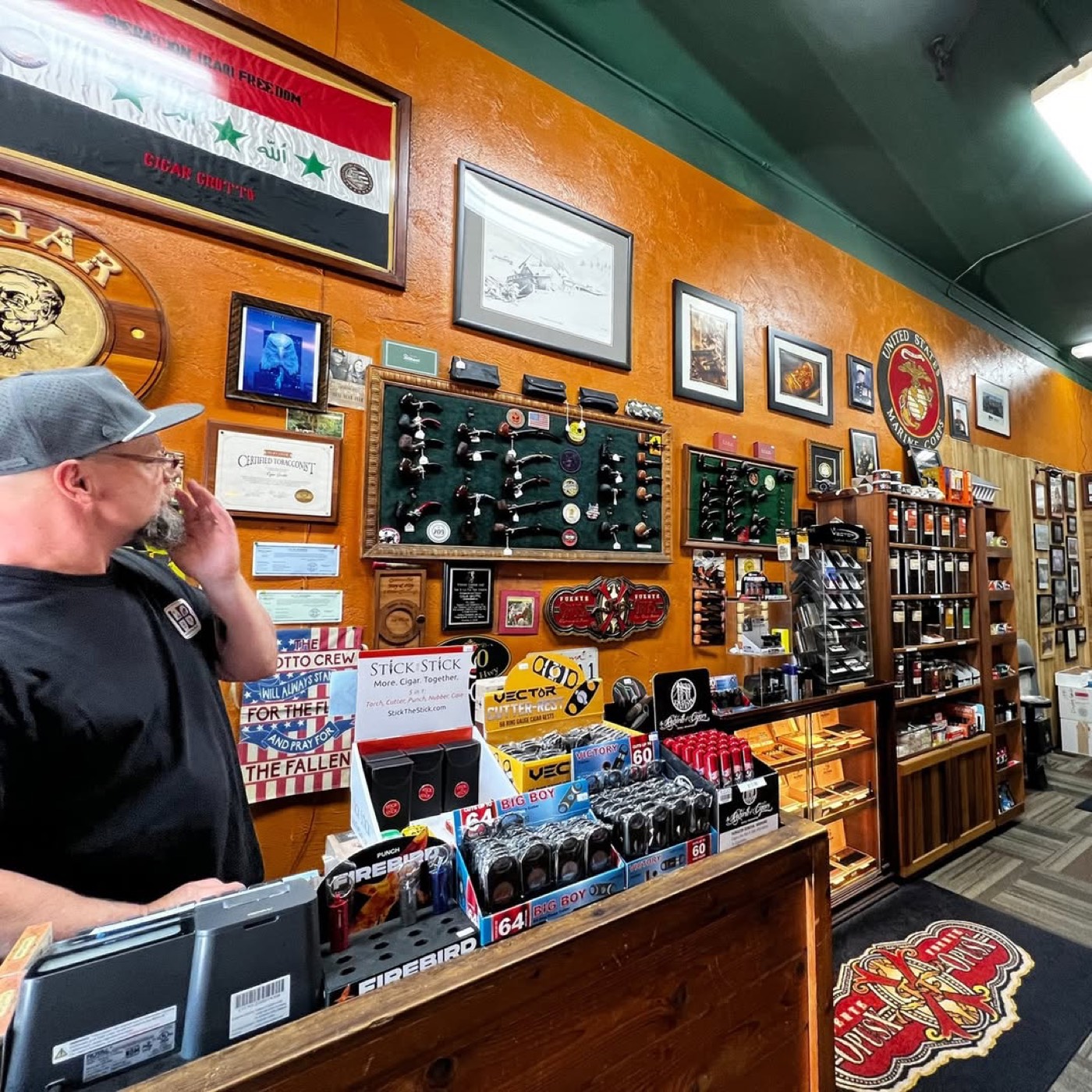 The counter and accessories wall at Cigar Grotto
